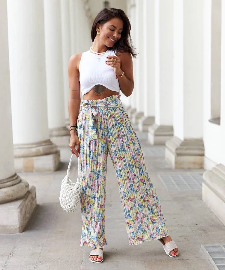 Żółte plisowane spodnie w kwiaty Cesate