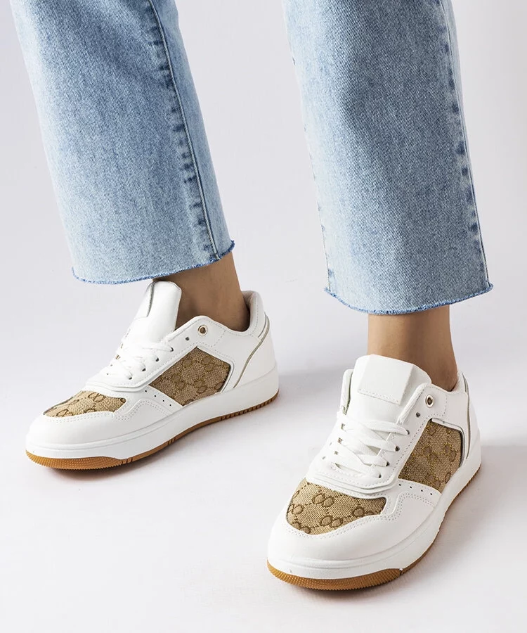 Białe sneakersy zdobione monogramem Isidora