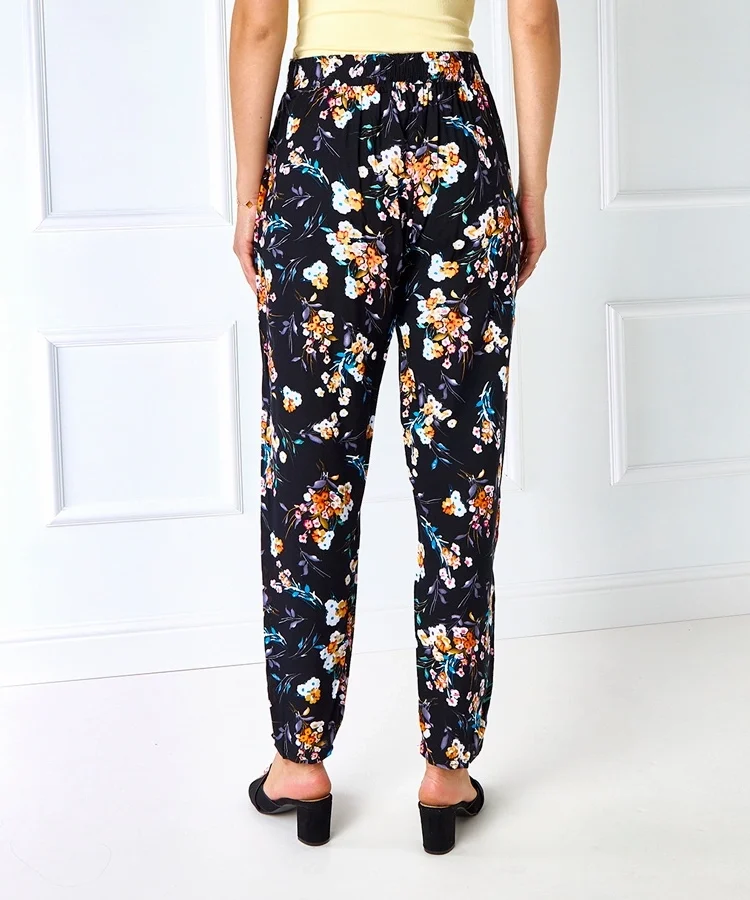 Pomarańczowe spodnie w kwiaty Bazzi