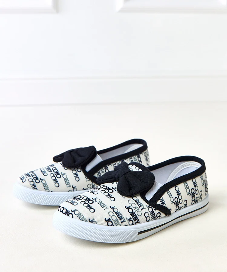 Białe tenisówki dziecięce z kokardką Missi